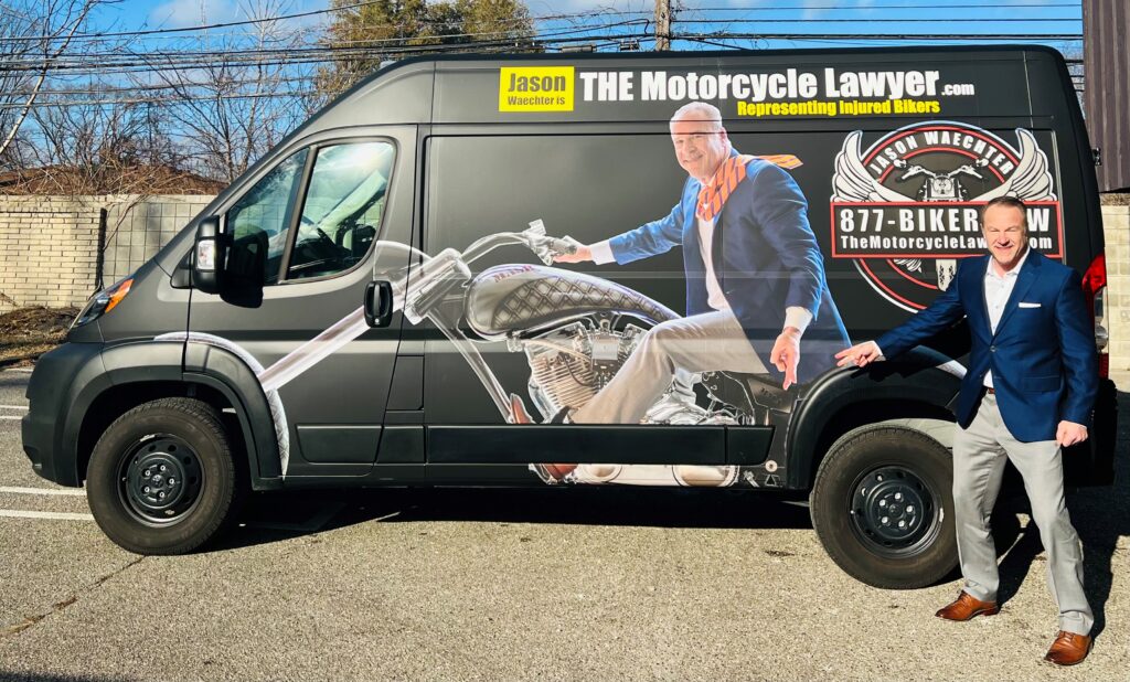 Jason Waechter standing next to The Motorcycle Lawyer van