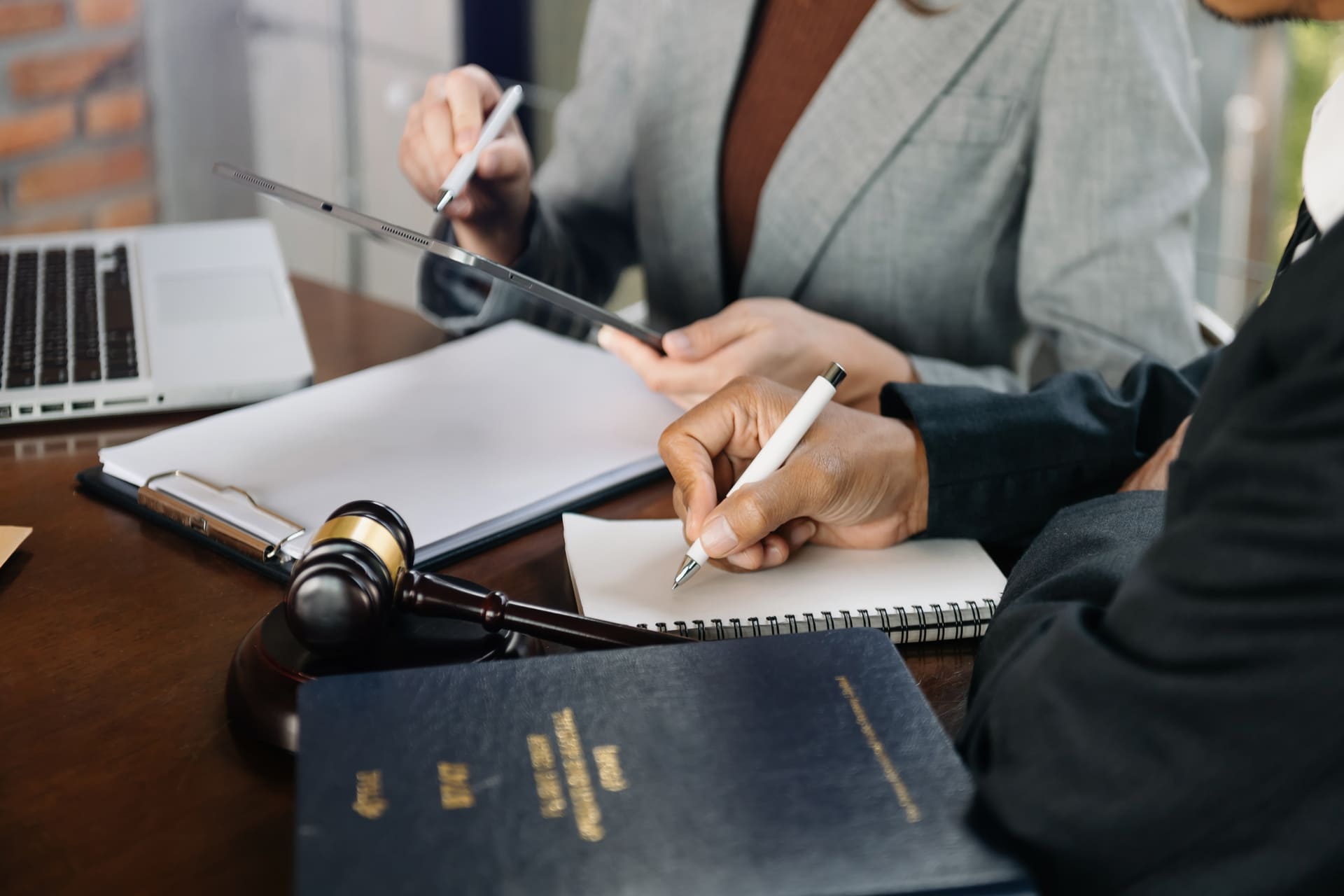 business people and lawyers discussing contract