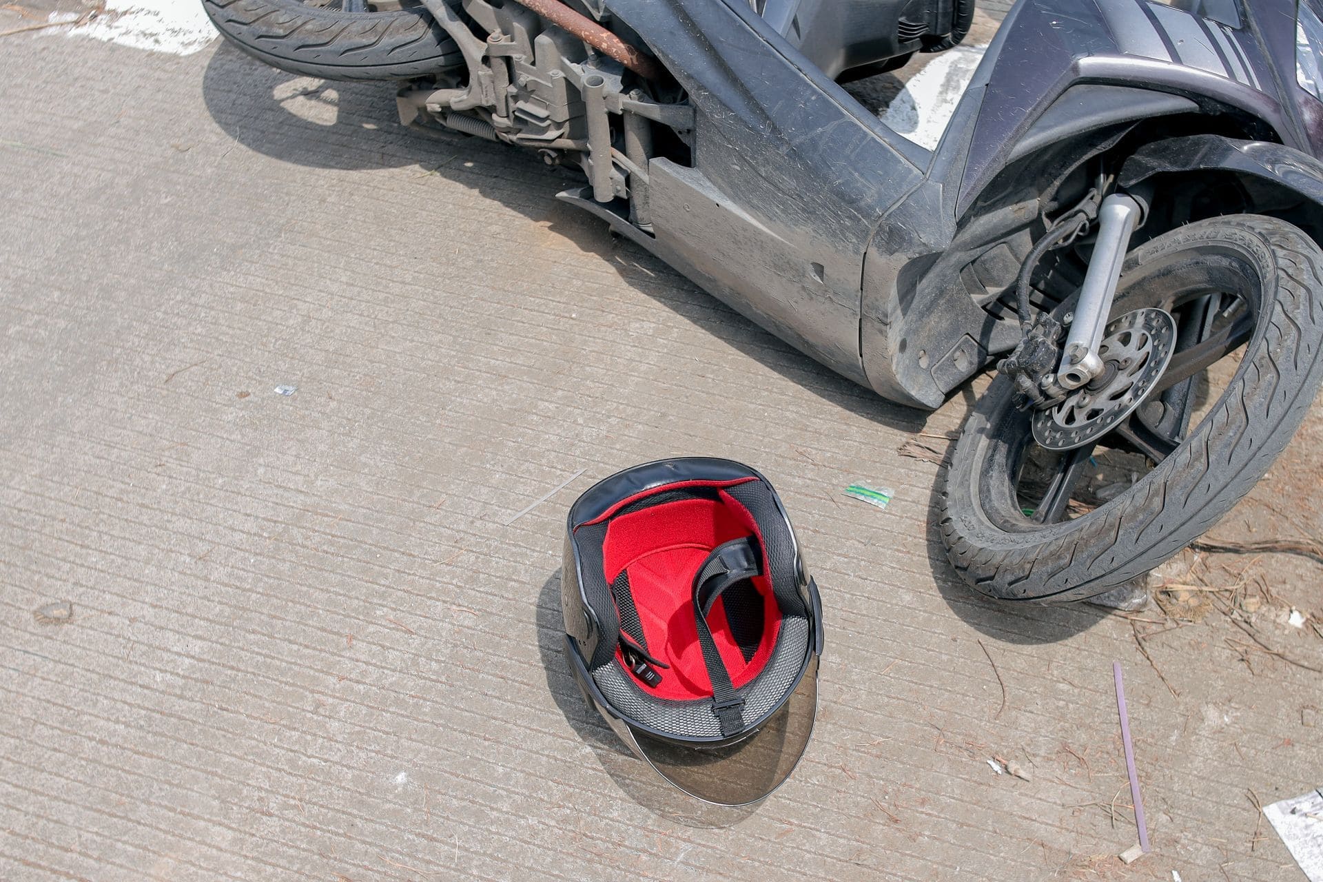 motorcycle accident aftermath showing fallen bike